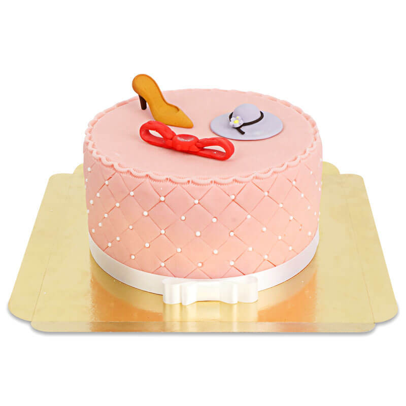 Deluxe Make-Up Cake med färgglada sockerdekorationer och vitt band